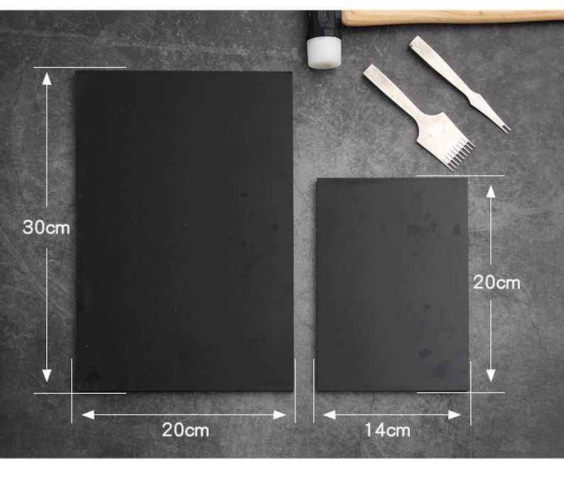 May include: Two black rectangular cutting mats, one measuring 20 inches by 30 inches and the other measuring 14 inches by 20 inches.