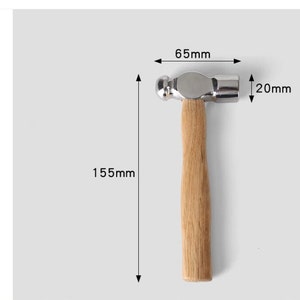 May include: A silver ball-peen hammer with a wooden handle. The hammer is 6.5 inches long and 2 inches wide. The handle is 15.5 inches long.