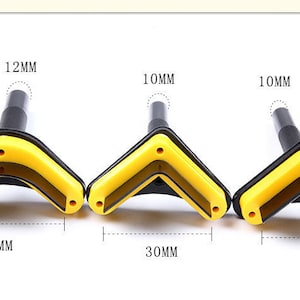 May include: Three black and yellow plastic corner clamps with different sizes: 40mm, 30mm, and 35mm. The clamps have a 12mm, 10mm, and 10mm diameter hole in the center.