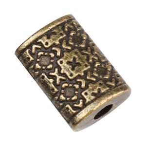 May include: A gold-toned metal bead with a geometric pattern. The bead has a hole in the center for stringing.