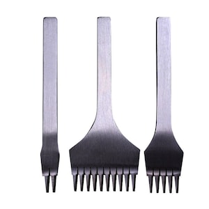 May include: Three metal leather craft tools with different sized punch heads. The tools are used for creating holes in leather for stitching.