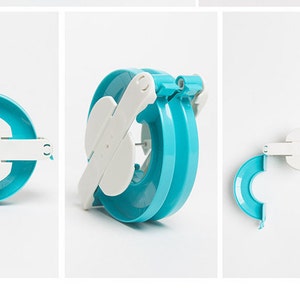May include: A blue and white plastic yarn bowl for making pom-poms. The bowl is made of two halves that snap together.