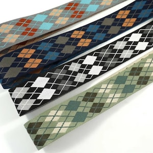 May include: Four different patterned elastic bands with a diamond pattern. The bands are in shades of blue, green, brown, and gray.