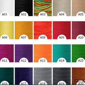 May include: A color chart of 20 different thread spools. The spools are arranged in four rows of five. The colors include white, black, multi-colored, beige, light brown, yellow, orange, red, pink, purple, orange, teal, green, dark green, dark purple, gray, dark gray, brown, and a light brown.