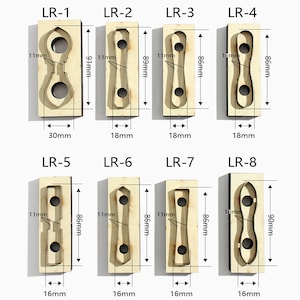 May include: Eight different die-cut shapes for crafting projects. The shapes are labeled LR-1 through LR-8 and are made of wood. The shapes are various sizes and include a heart, a teardrop, a circle, and a rectangle.