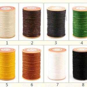 May include: Eight spools of waxed thread in various colors, including white, black, brown, green, yellow, and orange. The spools are labeled with numbers 1 through 8.