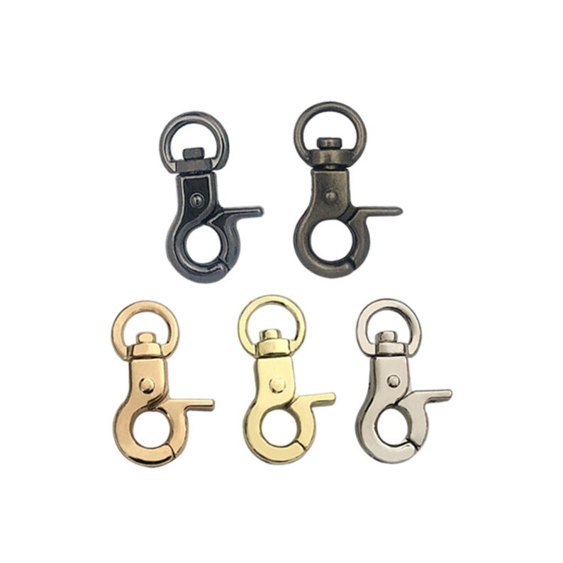 May include: Five metal swivel clasps in different finishes: antique brass, gold, nickel, black nickel, and antique silver.