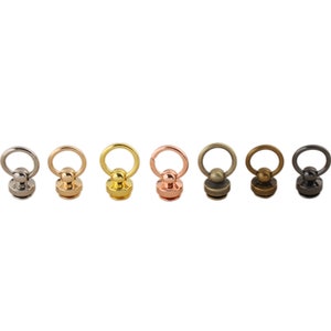 May include: A set of six metal swivel snap hooks in different finishes: silver, gold, rose gold, antique brass, bronze, and black.