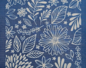 May include: A blue background is covered with a white floral pattern. The design includes various flowers, leaves, and sprigs. The text "moiko 20.34" is in the upper left corner, and "moiko" is in the lower right corner. The design is suitable for crafts.