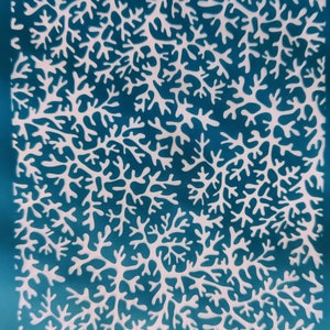 May include: A blue background with a white pattern of abstract branches. The text "WOJKO '53" appears at the top and bottom of the image.