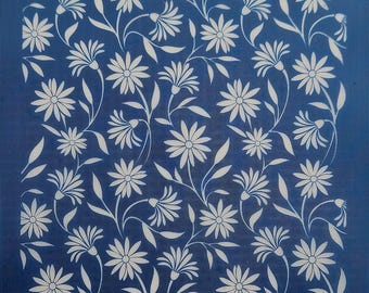 May include: A blue stencil with a white daisy pattern. The stencil is made of a durable material and is perfect for creating beautiful designs on a variety of surfaces.