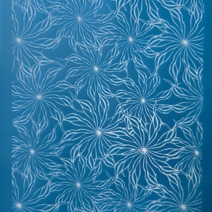 May include: A blue background with a white pattern of stylised flowers. The text "moko 12.48" appears in the top right corner and "moko" appears in the bottom left corner.