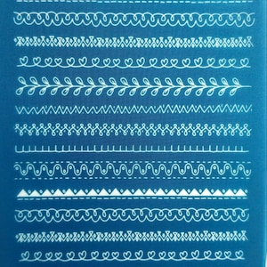 May include: A blue background with 14 white lines of different decorative patterns. The patterns include zigzags, waves, hearts, and leaves. The text "moiko 10 25" is at the top of the image and the text "moiko" is at the bottom of the image.