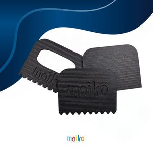 May include: Three black grout removal tools with the brand name "moiko" embossed on them. One tool has a handle and a toothed edge, while the other two have rounded edges. The tools are made of a textured material.