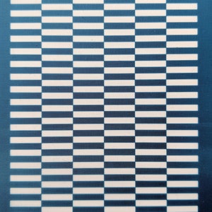 May include: A blue and white checkered pattern on a blue background. The pattern is made up of horizontal and vertical lines. The text "moiko 11.39" appears in the top left corner and "moiko" appears in the bottom right corner.