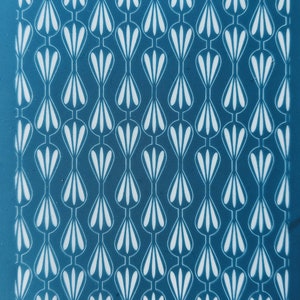 May include: A teal blue background with a repeating pattern of white stylised teardrop shapes.