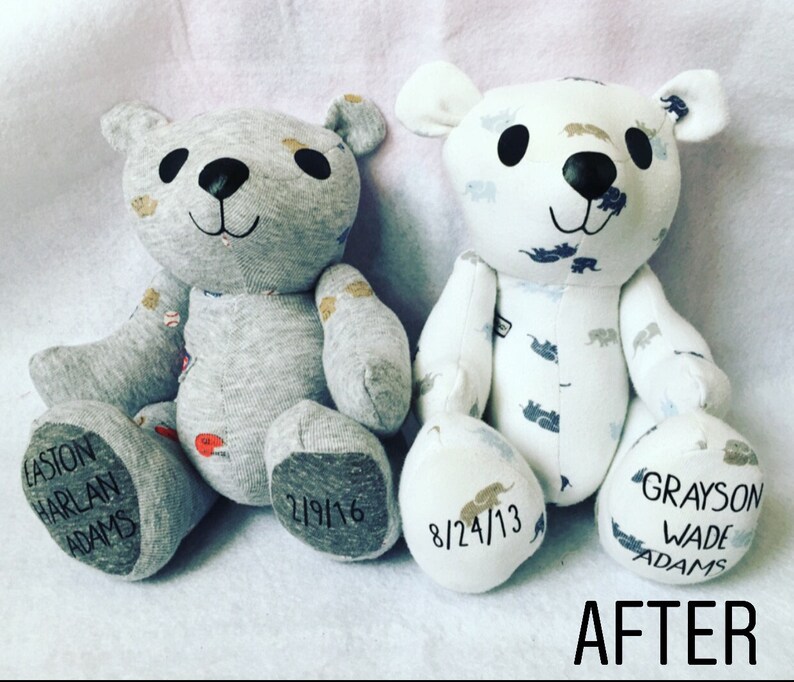 May include: Two stuffed bears made from fabric. The left bear is grey with baseball patterns and has the text EASTON HARLAN ADAMS and 2/9/16 on its feet. The right bear is white with elephant patterns and has 8/24/13 and GRAYSON WADE ADAMS on its feet.