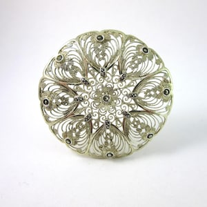Vintage BIRKS ronde filigraan broche van sterlingzilver en marcasiet