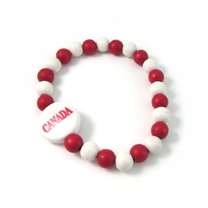 Oh, CANADA! - Red and White WOOD Beaded Bracelet - with Central Flag Bead