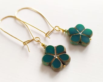 Golden earrings with green glass and ceramic flower pendant