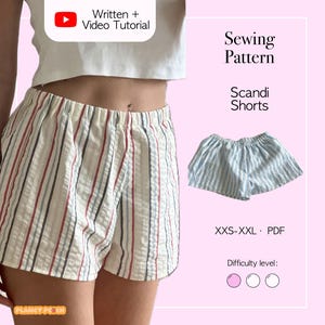 May include: Cream shorts with red, grey, and blue vertical stripes. A smaller pair of blue and white striped shorts is also shown. The image includes the text "Sewing Pattern Scandi Shorts" and "Written + Video Tutorial".
