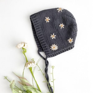 Hand Knit Cotton Merino Baby Bonnet in Dark Grey with hand embroidered daisy flowers