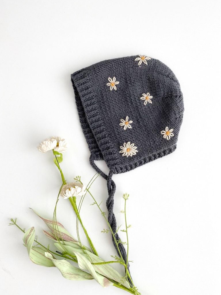 Hand Knit Cotton Merino Baby Bonnet in Dark Grey with hand embroidered daisy flowers