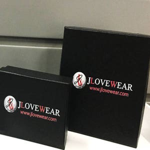May include: Two black boxes with the logo "JLOVEWEAR" and the website address "www.jlovewear.com" printed in white and red.