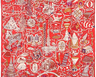 May include: A square silk scarf in a vibrant red hue featuring a detailed white and multi-colored graphic print. The design depicts a complex map-like illustration of various architectural structures, figures, and vehicles with the text EXPOSITION UNIVERSELLE.