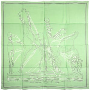 May include: A square light green scarf featuring a white and grey line art illustration of a horse-drawn carriage. The design includes the text "Caleche elastique" and "HERMES PARIS" printed in a grey font. The scarf has a thin grey border.