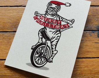 Cat Riding Unicycle Christmas Card
