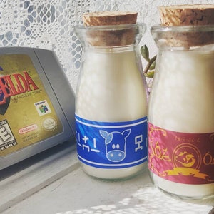 Legend of Zelda Lon Lon Mjölk och Chateau Romani Paket med 2 Ljus | 100 % Sojavax | Sojaljus | Ofärgat Sojavax | Naturligt Vax | Nördiga Gåvor bild 2