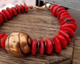 Coral and hematite beaded bracelet with large copper bead for your focal point. Red coral saucer beaded bracelet. Chunky beaded bracelet.