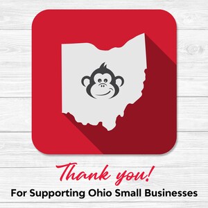 May include: A red square with a white outline and a long shadow. Inside the square is a white outline of the state of Ohio with a smiling monkey face in the center. The text "Thank you!" is below the square and the text "For Supporting Ohio Small Businesses" is below that.