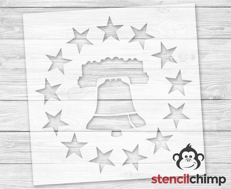 May include: Stencil design featuring a Liberty Bell surrounded by a circle of stars. The stencil is white and is designed for use with paint or other mediums.