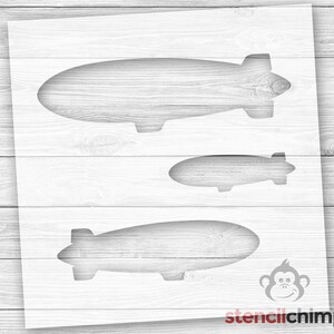 May include: Stencil design for three different sizes of airships. The stencil is white and is on a wood background. The stencilchimp logo is in the bottom right corner.