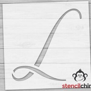 May include: A stencil of the letter L in a cursive font. The stencil is made of white plastic and is designed for use with paint or other mediums. The stencil is shown on a wood background.