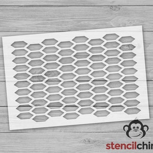 May include: White stencil with a honeycomb pattern. The stencil is made of a durable material and features a repeating hexagonal design. The stencil is ideal for various craft and DIY projects.