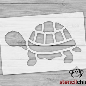 May include: A white stencil featuring a turtle design. The turtle has a detailed shell and is shown with its head and legs extended. The stencil is on a white background with the Stencil Chimp logo in the bottom right corner.