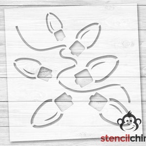 May include: A stencil design featuring a string of Christmas lights. The design is perfect for creating festive crafts and decorations.