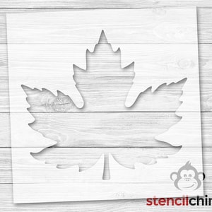 May include: A white stencil of a maple leaf, perfect for crafting and decorating projects.