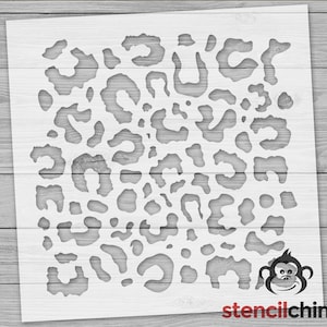 May include: A white stencil with a leopard print design. The stencil is made of a durable material and is perfect for creating unique and stylish projects.