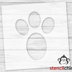 May include: White stencil of a paw print with four circles. The stencil is on a white wood background. The stencilchimp logo is in the bottom right corner.