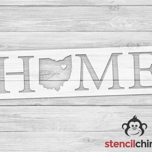 May include: White stencil with the word "HOME" in large letters. The letter "O" is replaced with the outline of the state of Ohio with a small heart in the center.