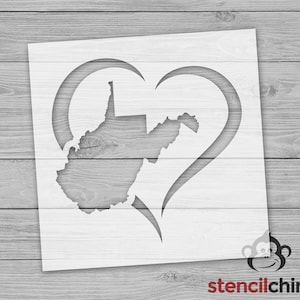 May include: White stencil of the state of West Virginia inside a heart shape. The stencil is on a woodgrain background.