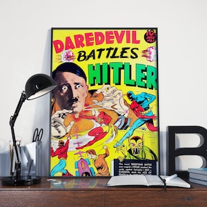 May include: A vintage comic book cover featuring Daredevil battling Hitler. The cover is yellow with red, blue, and green accents. The text on the cover reads "Daredevil Battles Hitler".