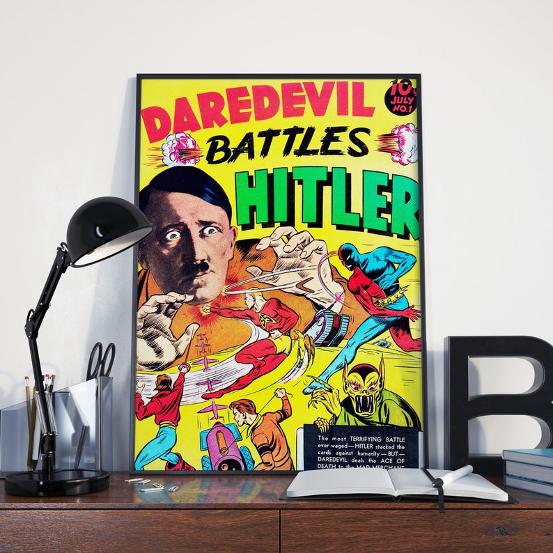 May include: A vintage comic book cover featuring Daredevil battling Hitler. The cover is yellow with red, blue, and green accents. The text on the cover reads "Daredevil Battles Hitler".