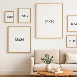 May include: A collection of framed art prints in various sizes, including 8x10, 10x10, 16x20, 18x18, 18x24, and 24x36 inches, displayed on a white wall. The frames have a light wood finish. A sofa, coffee table, and lamp are in the foreground.