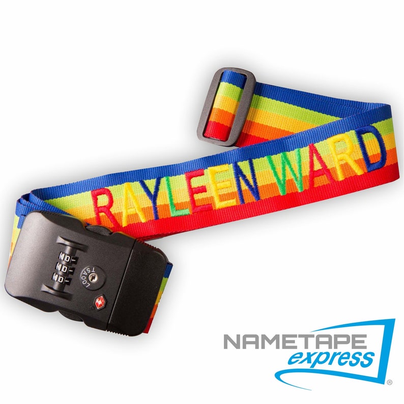 May include: A rainbow luggage strap with a combination lock and the name "RAYLEEN WARD" embroidered in colorful letters. The strap is made by Nametape Express.