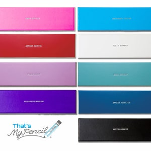 May include: A set of ten colorful boxes with names printed on them. The boxes are arranged in two rows of five. The boxes are all the same size and shape. The boxes are made of a smooth, glossy material. The names on the boxes are: Mia Greene,  Arthur Griffin,  Freda Snow,  Elizabeth Marlow,  Austin Draper,  Machada Vivant,  Alexa Summer,  Erin Cassidy,  Zander Hamilton,  and That's My Pencil.